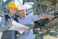 Supervisor giving instruction to plant worker