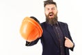 Supervisor or inspector concept. Construction supervisor shouting with helmet in his hand Royalty Free Stock Photo
