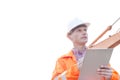 Supervisor looking away while holding clipboard against clear sky Royalty Free Stock Photo