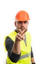 Supervisor builder making eyes on you gesture with fingers