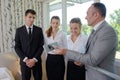 Supervisor showing hotel staff vacuum carpet attachment Royalty Free Stock Photo