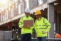 Supervisors and engineering use laptop at the construction site