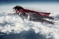 The superwoman flying above the skies Royalty Free Stock Photo