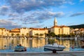 Supetar town on Brac Island, Croatia. Harbor with boats, palm trees, cafes and church Royalty Free Stock Photo