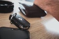 Supetar, Croatia August 2020 Car keys from a Renault Clio, wallet and phone laying on a wooden table. People emptying their Royalty Free Stock Photo