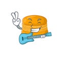 Supper cool orange macaron cartoon playing a guitar