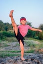 Supple young boy doing exercises