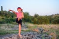 Supple young boy practicing pilates outdoors