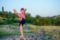 Supple young boy practicing pilates outdoors