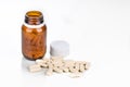 Supplement in caplet format with opaque glass bottle on white background