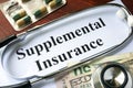 Supplemental Insurance written on a paper.