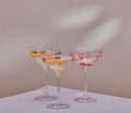 Mixed cocktails on white surface.