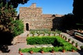 Supplier courtyard and gardens at the Nasrid Palace in Malaga castle. Royalty Free Stock Photo