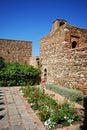 Supplier courtyard and gardens at the Nasrid Palace in Malaga castle. Royalty Free Stock Photo