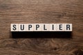Supplier - word concept on building blocks, text Royalty Free Stock Photo