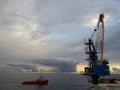 A supply boat is standby near the oil drilling rig at offshore Sarawak, Malaysia.