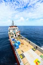 Supply boat transfer cargo to oil and gas industry and moving cargo from the boat to the platform, boat waiting transfer cargo Royalty Free Stock Photo