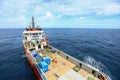 Supply boat transfer cargo to oil and gas industry and moving cargo from the boat to the platform, boat waiting transfer cargo Royalty Free Stock Photo