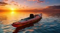 Supply kayak boat against the background of orange sunset Royalty Free Stock Photo