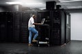 IT support, black man or coding on computer in server room for big data, network glitch or digital website. Code, fixing Royalty Free Stock Photo