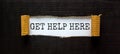 Support and get help here symbol. Words `get help here` appearing behind torn black paper. Beautiful black background. Business,