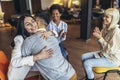 Support group patients hug each other during the therapy session Royalty Free Stock Photo