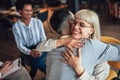 Support group patients hug each other during the therapy session Royalty Free Stock Photo