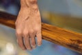 support, help and people concept - close up of man hand holding to railing Royalty Free Stock Photo