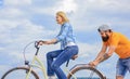 Support helps believe in yourself. Support and friendship. Woman rides bicycle sky background. Man helps keep balance Royalty Free Stock Photo