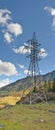 Support high-voltage power line. Mountain landscape