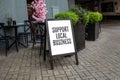 Support Local Business. Advertising banner on the street Royalty Free Stock Photo