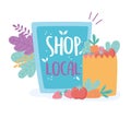 Support local business, shop small market, board and paper bag with food