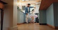 Support, love and ballet girl bonding with father in a kitchen together, excited and playing as a dancer pr ballerina