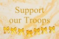 Support our Troops message with yellow ribbons on textured watercolor paper