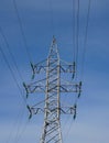 Power line support against blue sky background Royalty Free Stock Photo