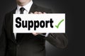 Support sign is held by businessman Royalty Free Stock Photo