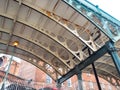 Support struts and posts underneath an old cast iron bridge built in 1834