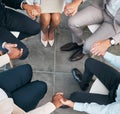 Support, teamwork and unity of business group holding hands and sitting in a circle doing a team building plan. People Royalty Free Stock Photo