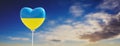 Support Ukraine, stop war, truce peace. Ukrainian flag heart shape balloon on cloudy sky. 3d render