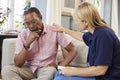 Support Worker Visits Senior Man Suffering With Depression Royalty Free Stock Photo