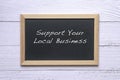 Support Your Local Business, words written on blackboard Royalty Free Stock Photo