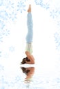 Supported headstand on white sand Royalty Free Stock Photo