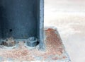 Supported steel plate with bolts on concrete floor Royalty Free Stock Photo