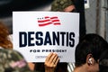 Supporter of Florida Governor Ron DeSantis Holding Up a Sign