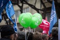 Supporters of the Serbian Green Party part cheering and waiving their green baloons in a political meeting.