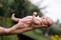 Supporting Hands. Father holding his 14 days old baby girl on his arms Royalty Free Stock Photo