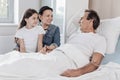 Supportive family visiting their husband and father in hospital Royalty Free Stock Photo