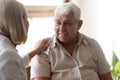 Supportive female nurse take care of senior male patient Royalty Free Stock Photo