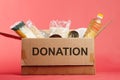 Supportive housing or food donation for poor. Donation box on a red background Royalty Free Stock Photo