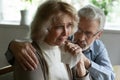 Supportive mature grey haired husband comforting soothing crying senior wife Royalty Free Stock Photo